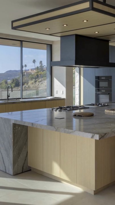 Milano Granite - Installation of new quartzite kitchen countertops featuring a island with waterfall panel and integrated stone sinks by Milano Granite - Countertop Installation Near Me - Van Nuys, California