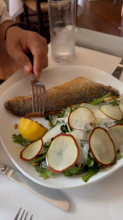 Brossa's Cibo e Vino - Juicy lemon to top off the branzino and arugula salad - Italian Near Me - Brenham, Texas