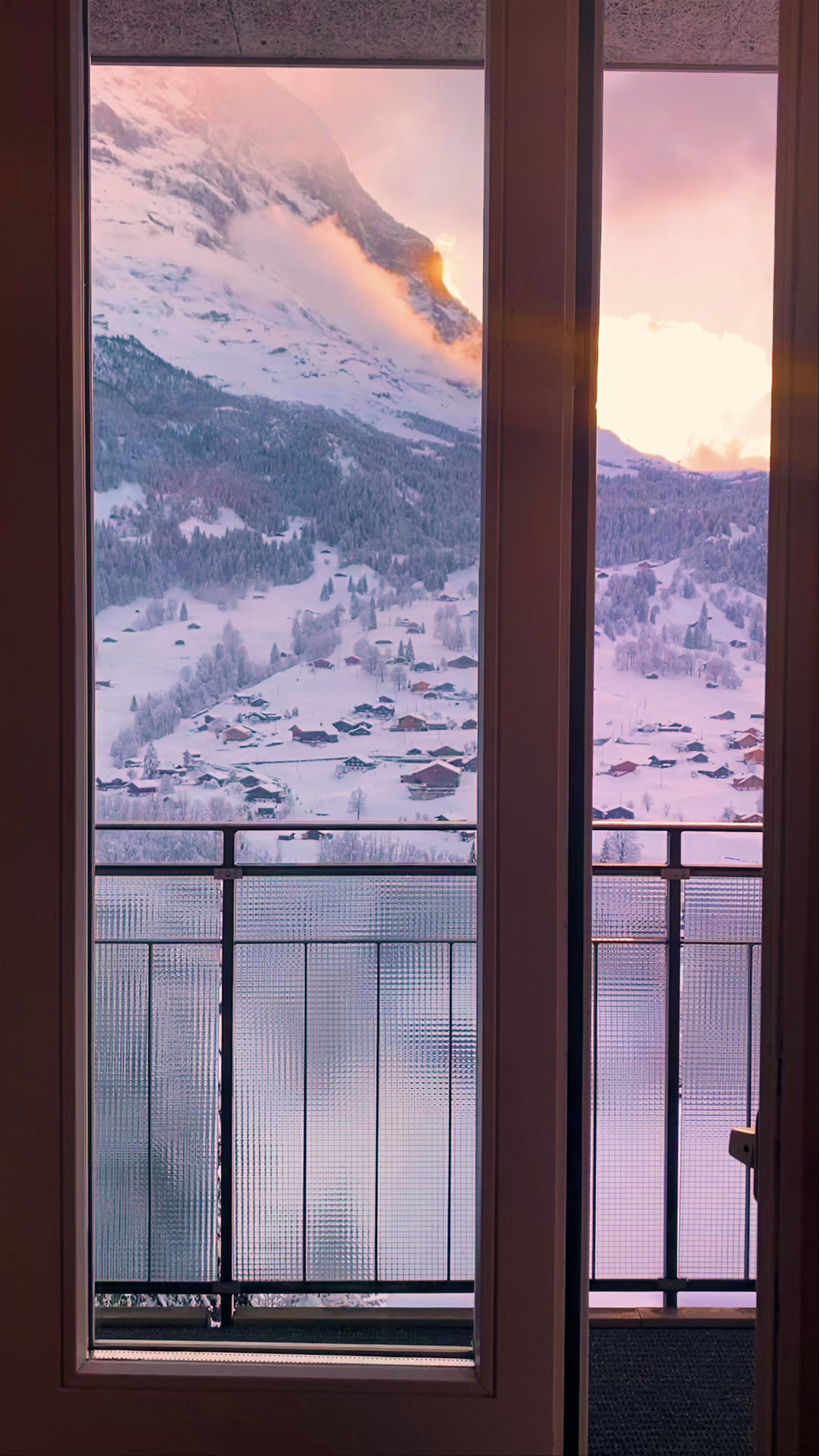 Winter Sunrise over Snowy Grindelwald from Belvedere Swiss Quality Hotel Balcony