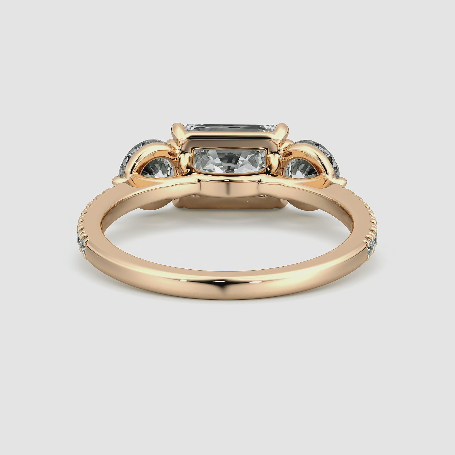 The Three Stone | Radiant | 14k | Rose Gold | bandAccent: Pavé | diamondOrientation: horizontal | sideStoneCarat: 0.50ct | sideStoneShape: Round Brilliant | caratWeight: other