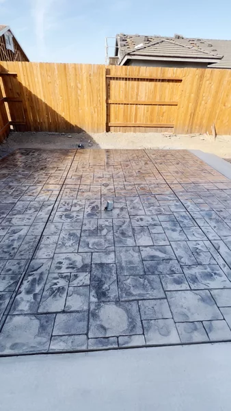 Stamped concrete patio with cobblestone pattern