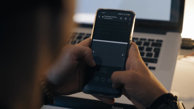 A graphic designer scrolls his website
