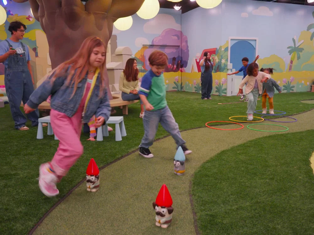 Video showing children and families playing in Bluey's Backyard only at CAMP