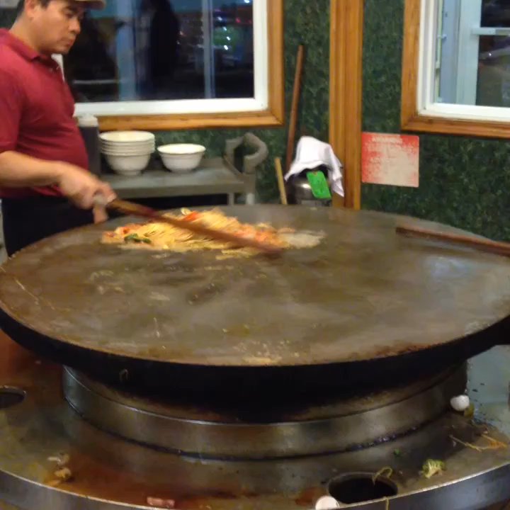 Mongolian Grill - This is how they cook your fresh food.  Don't forget to leave a tip. - Chinese Near Me - Mankato, Minnesota