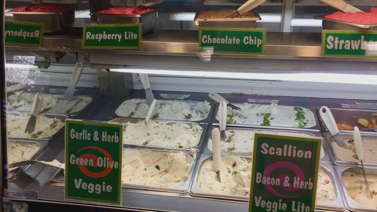Bagel Cafe - Inside the refrigerator case - check out all the delicious flavored spreads and sides - as you stand in the line to order - Bagels Near Me - Herndon, Virginia