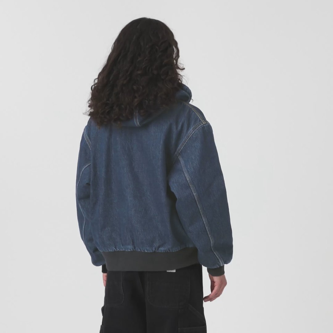 Model wearing a Carhartt WIP Women's OG Active Jacket in Blue Denim
