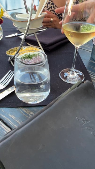 Apéro - Waitress explains caviar and side options - Bars Near Me - Washington, DC, District of Columbia