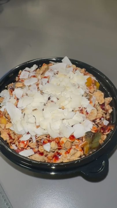 Acai n'Me - Half Acai, Half Mango Cream, strawberries, kiwis, mangos, granola, coconut flakes, and date syrup. - Acai Bowls Near Me - Winter Park, Florida