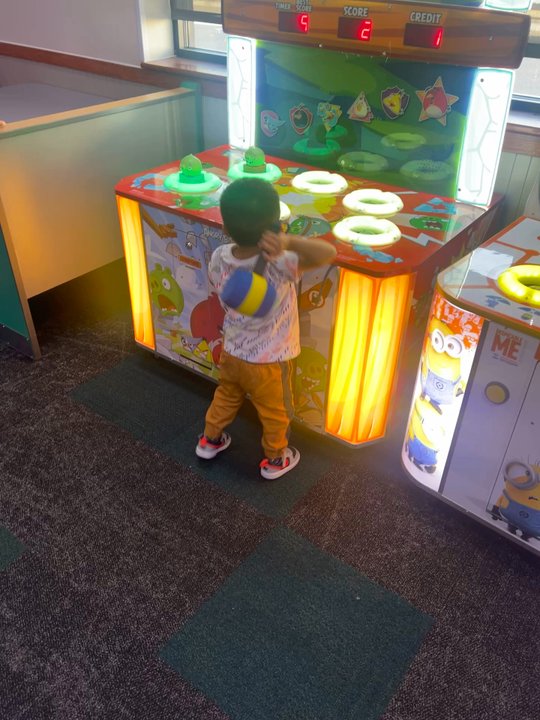 Chuck E. Cheese - My kid going at it at Wack a mole - Arcades Near Me - Tucson, Arizona