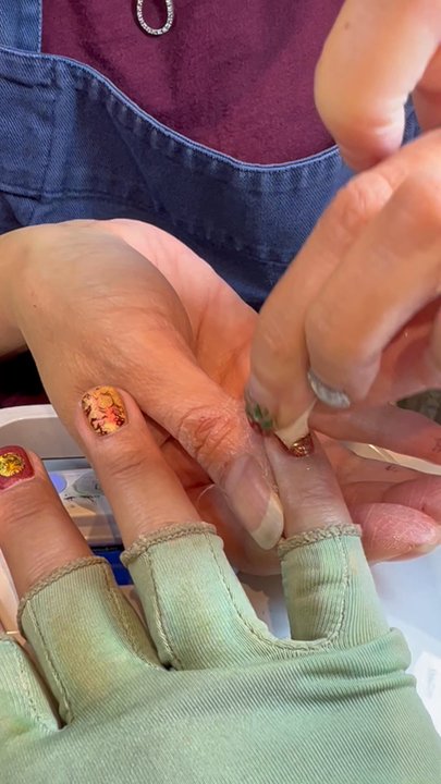 Gel O Nails - Adding the gold color to the stamped nails - Nail Salons Near Me - Oakland, California