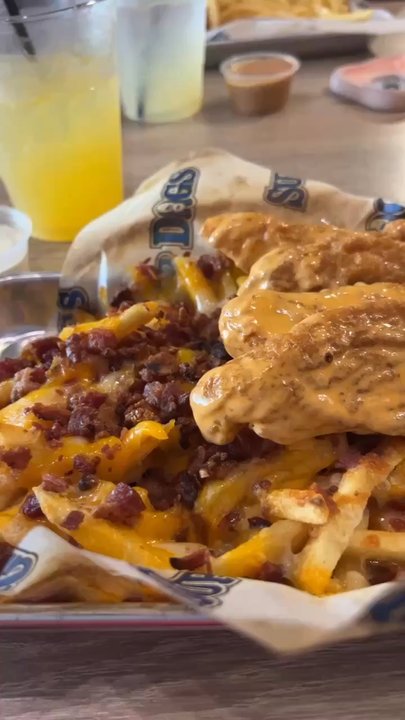 Sup Dogs - Chicken tenders tossed in buffalo sauce with bacon cheese fries - New American Near Me - Chapel Hill, North Carolina