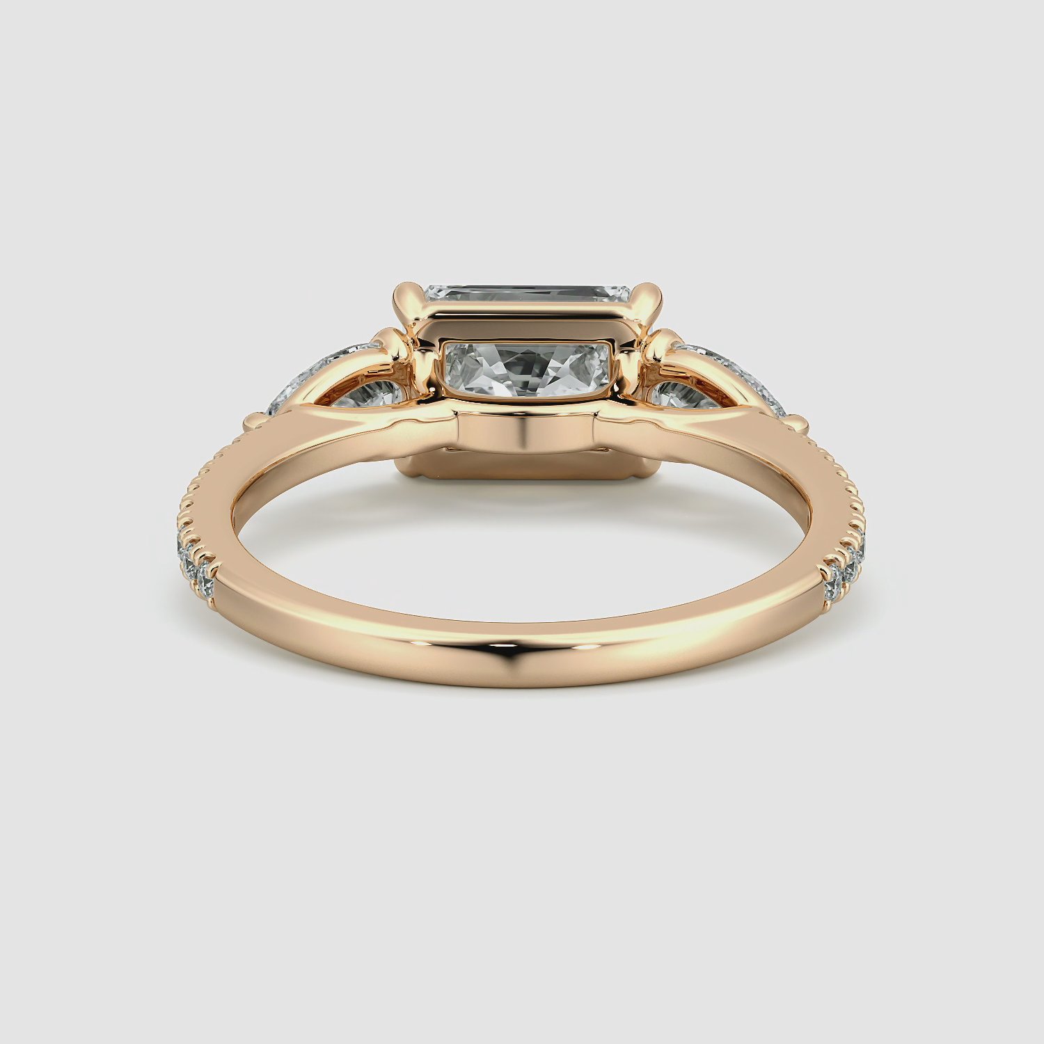 The Three Stone | Radiant | 14k | Rose Gold | bandAccent: Pavé | diamondOrientation: horizontal | sideStoneCarat: 0.25ct | sideStoneShape: Pear | caratWeight: other