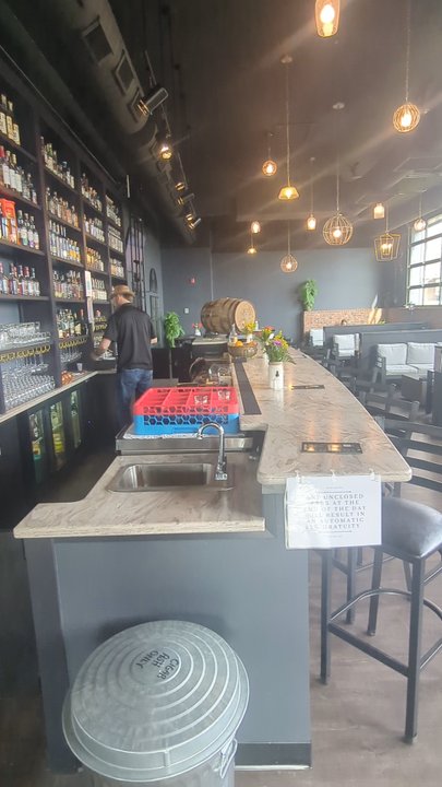 Slow Burn - There are two areas to sit. In this back area, the windows can retract to let air in. - Whiskey Bars Near Me - Middlebury, Indiana