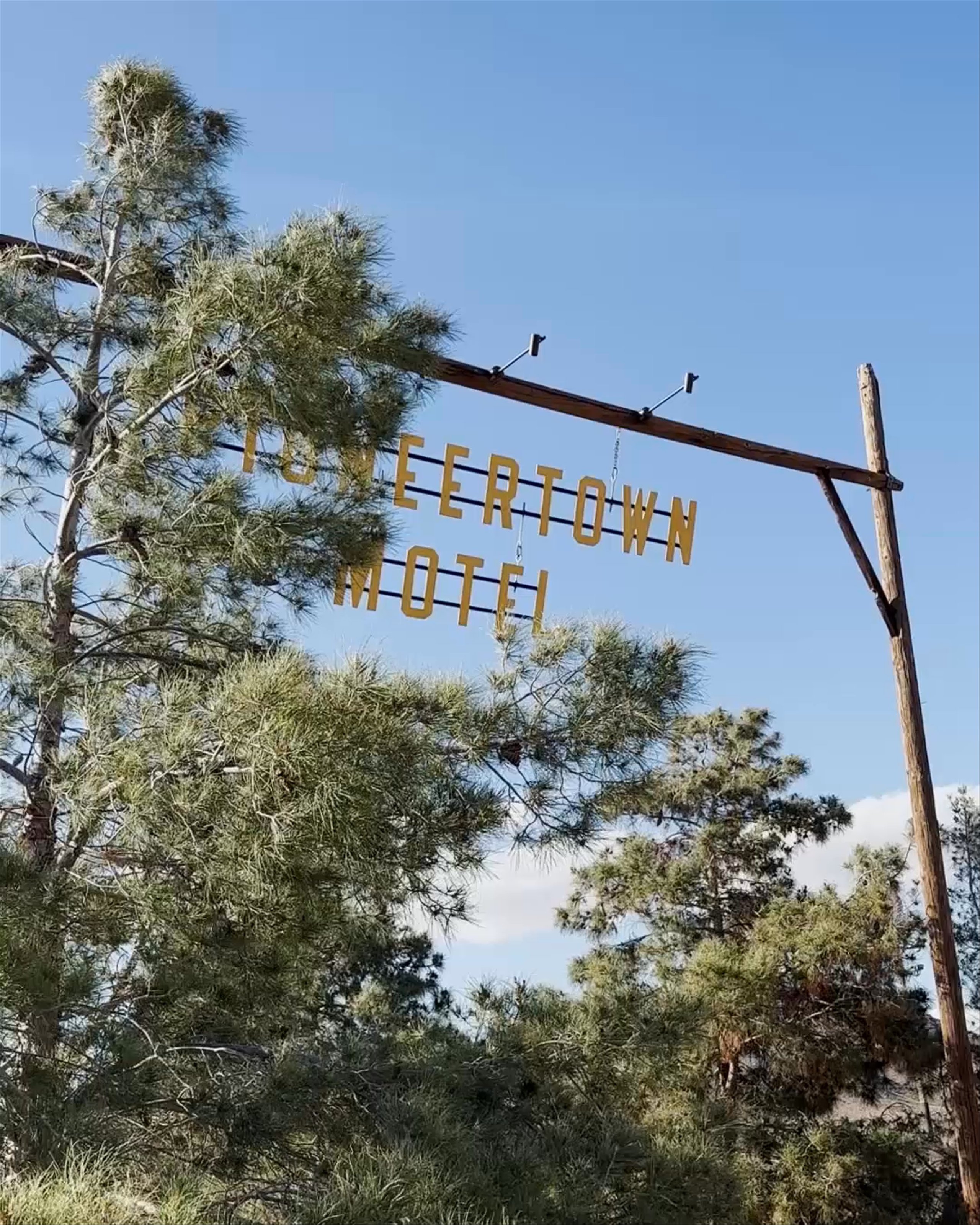 Pioneertown sign blowing in the wind