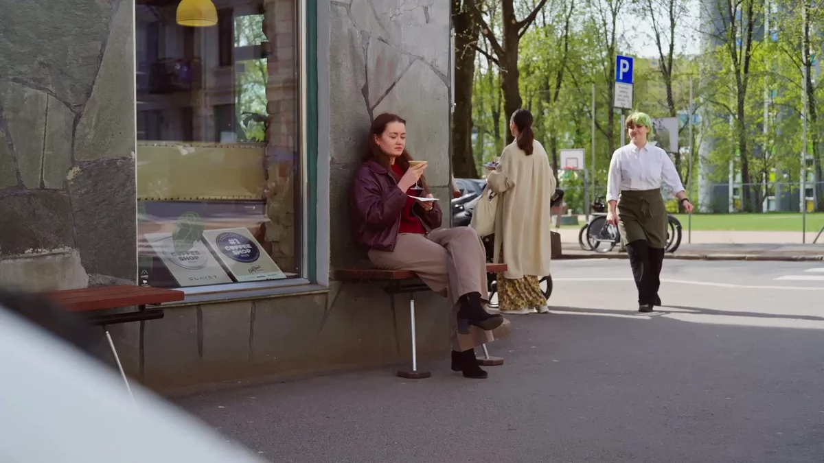 A woman drinking coffee at one of the worlds best coffee shops