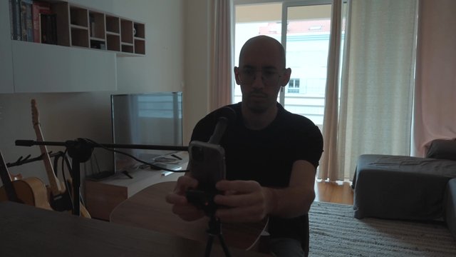 A guy securing a holder for his phone