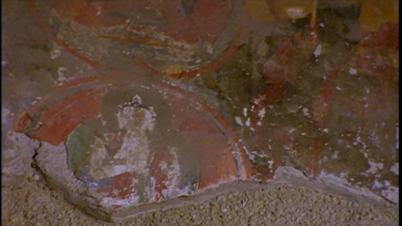 A researcher discusses the historical significance of Buddhist frescoes before the Dalai Lama elaborates on the evolution of large monastic institutions.