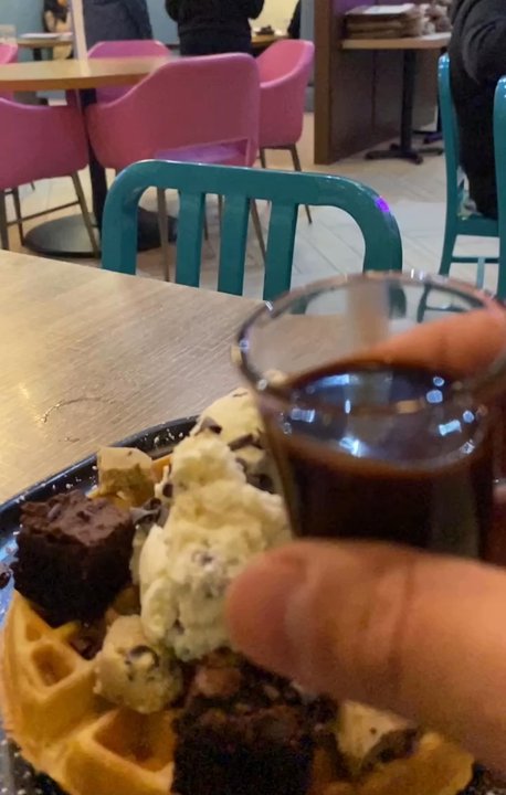 D Spot Dessert Cafe - Pouring a shot of chocolate onto our Cookie Monster waffle - Desserts Near Me - Ajax, Ontario