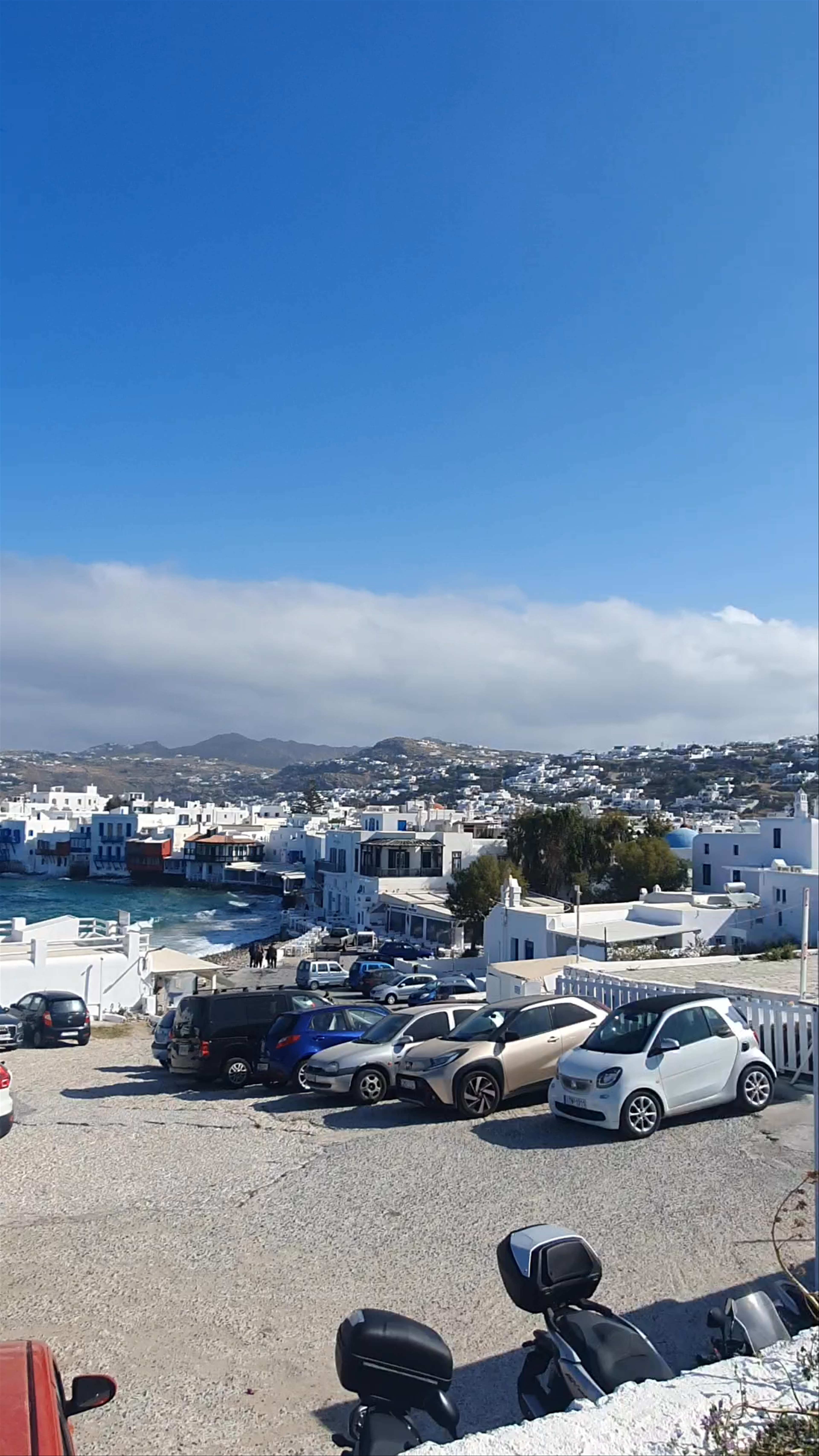 Windmills of Mykonos: Iconic White Sails Against Aegean Blue