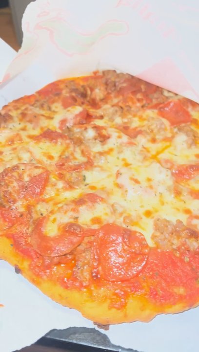 Phil's Pizza - Sausage and pepperoni pizza - Pizza Near Me - Chicago, Illinois