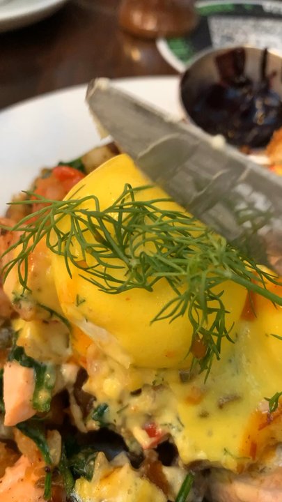 Blu Jam Cafe - Breaking that poached egg from Salmon Hash - Breakfast & Brunch Near Me - Los Angeles, California