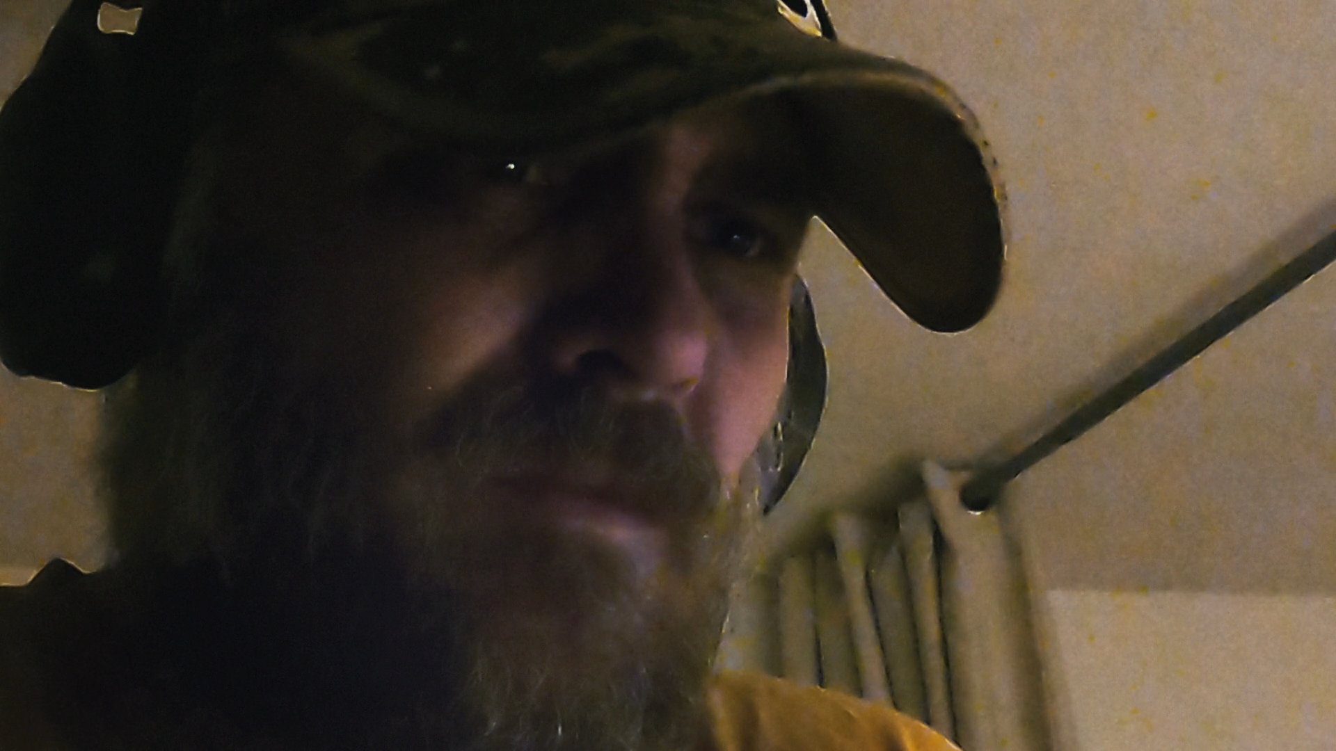 A man displays visible distress and emotional vulnerability, transitioning between states of grief and introspection. The sequence focuses on raw facial expressions and individual reactions to internal emotional conflict.