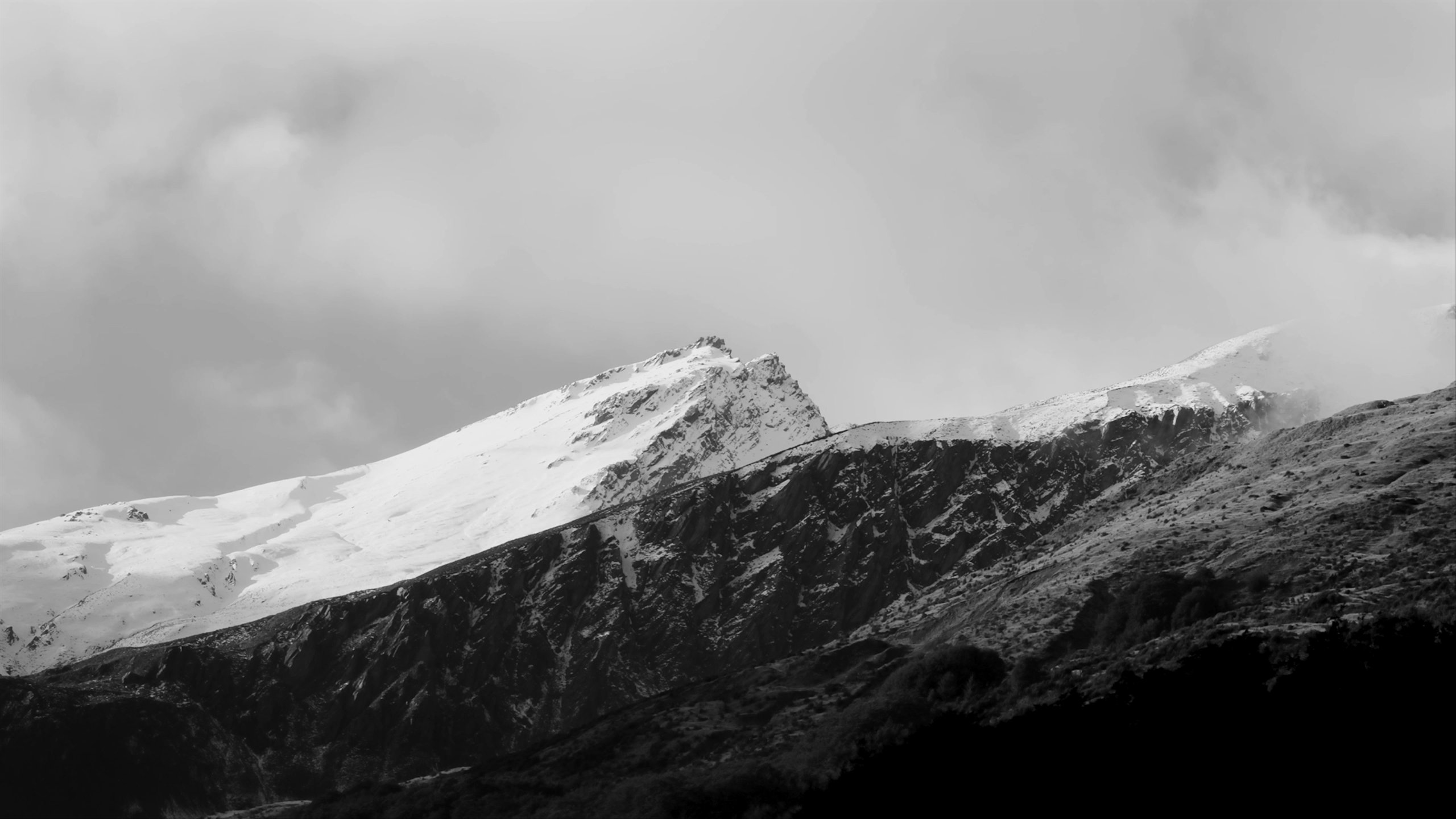 Timelape video of clouds rolling over snowy mountain in New Zealand