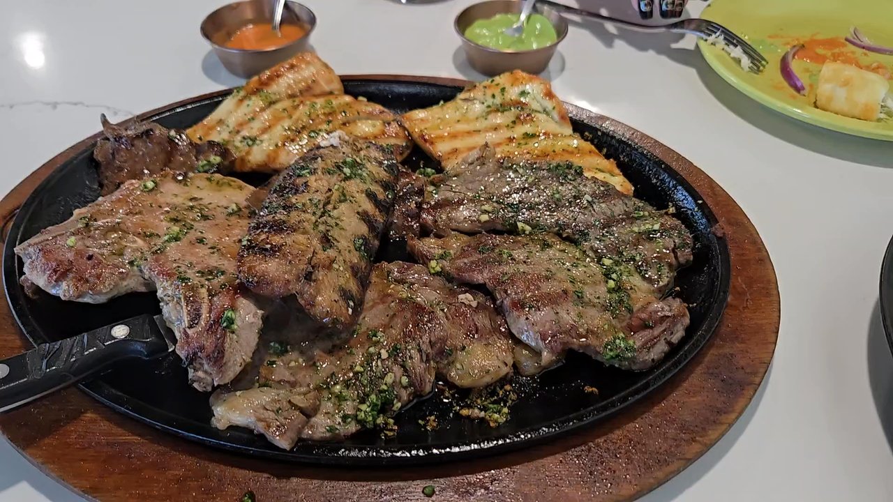 Lima Limon - Parrilla mixta with New York steak,  pork, chicken breast, anticucho (beef heart), sausage. Served with salad or fench fries. - Peruvian Near Me - Las Vegas, Nevada