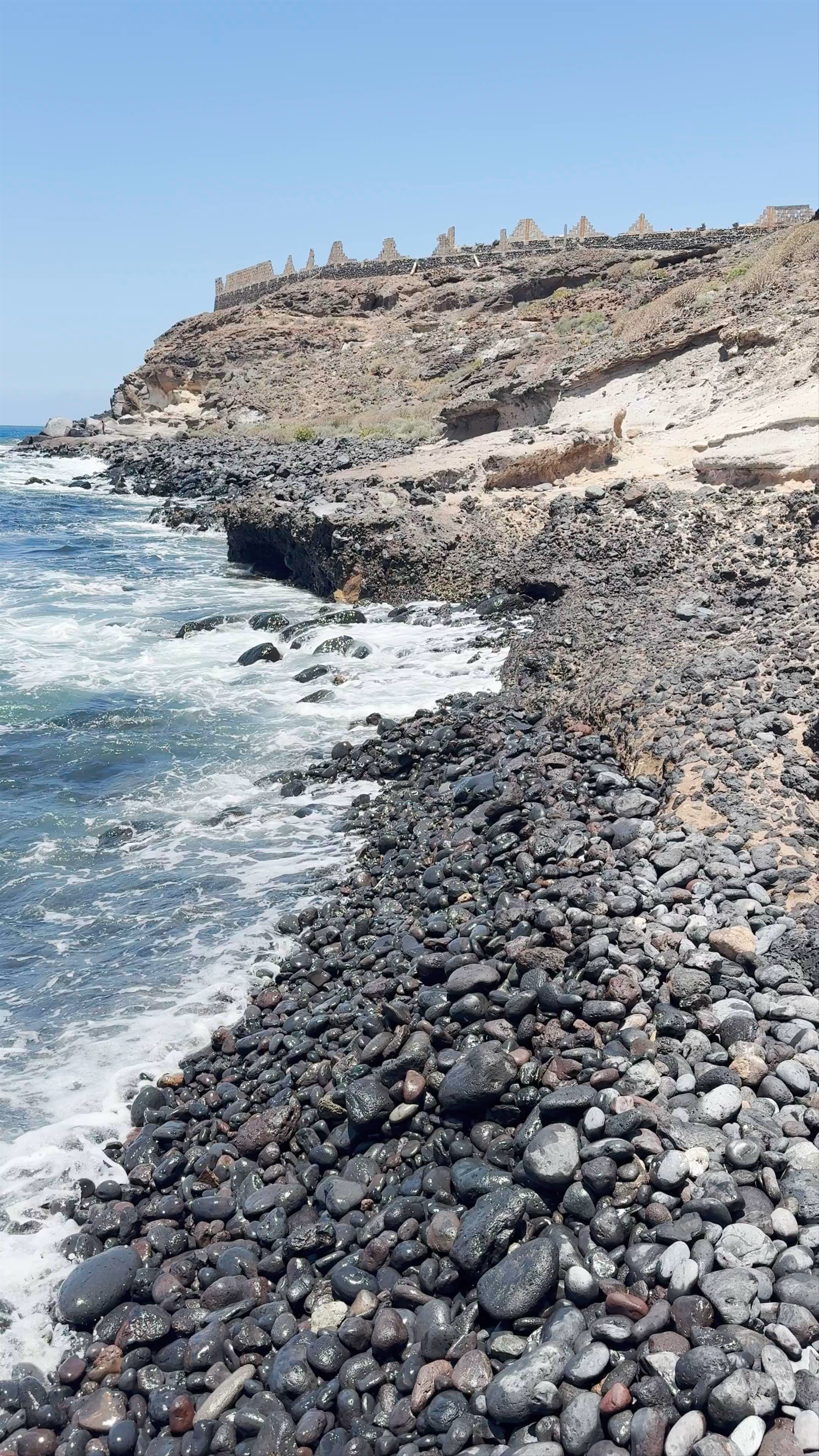 Waves Crashing on Rocky Coastline at Playa La Pardela, El Puertito, Spain
