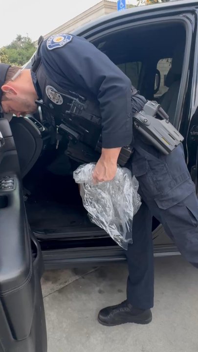 Pasadena Police Department - Officer checking the location of where it was found - Police Departments Near Me - Pasadena, California