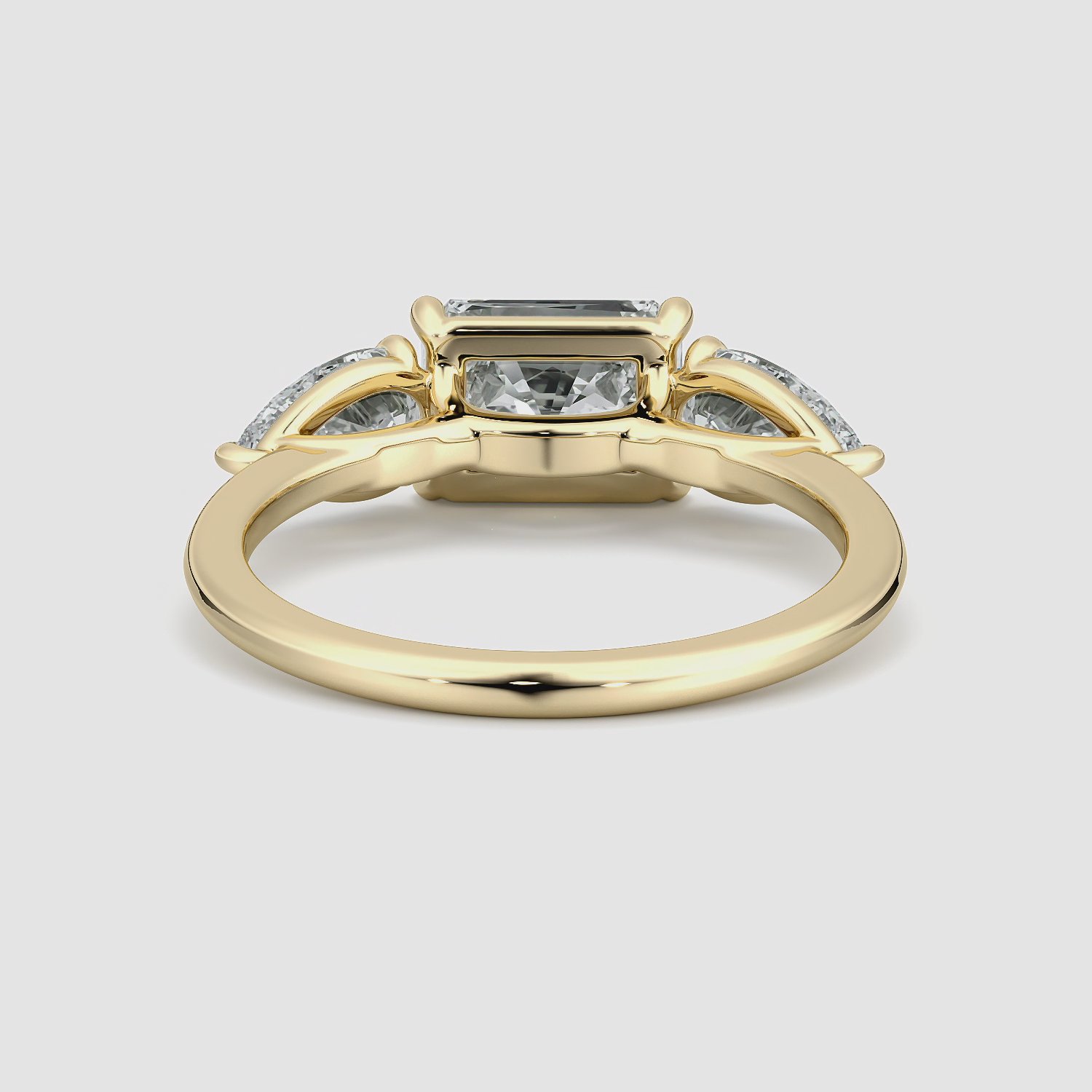 The Three Stone | Radiant | 18k | Yellow Gold | bandAccent: Plain | diamondOrientation: horizontal | sideStoneCarat: 0.50ct | sideStoneShape: Pear | caratWeight: other