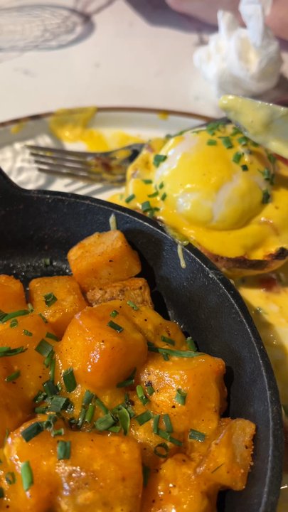 The Bird - Colonial benny English muffin topped with bacon jam, poached eggs, hollandaise and garnished with chivesz $14. It was DELICIOUS - Breakfast & Brunch Near Me - Norfolk, Virginia