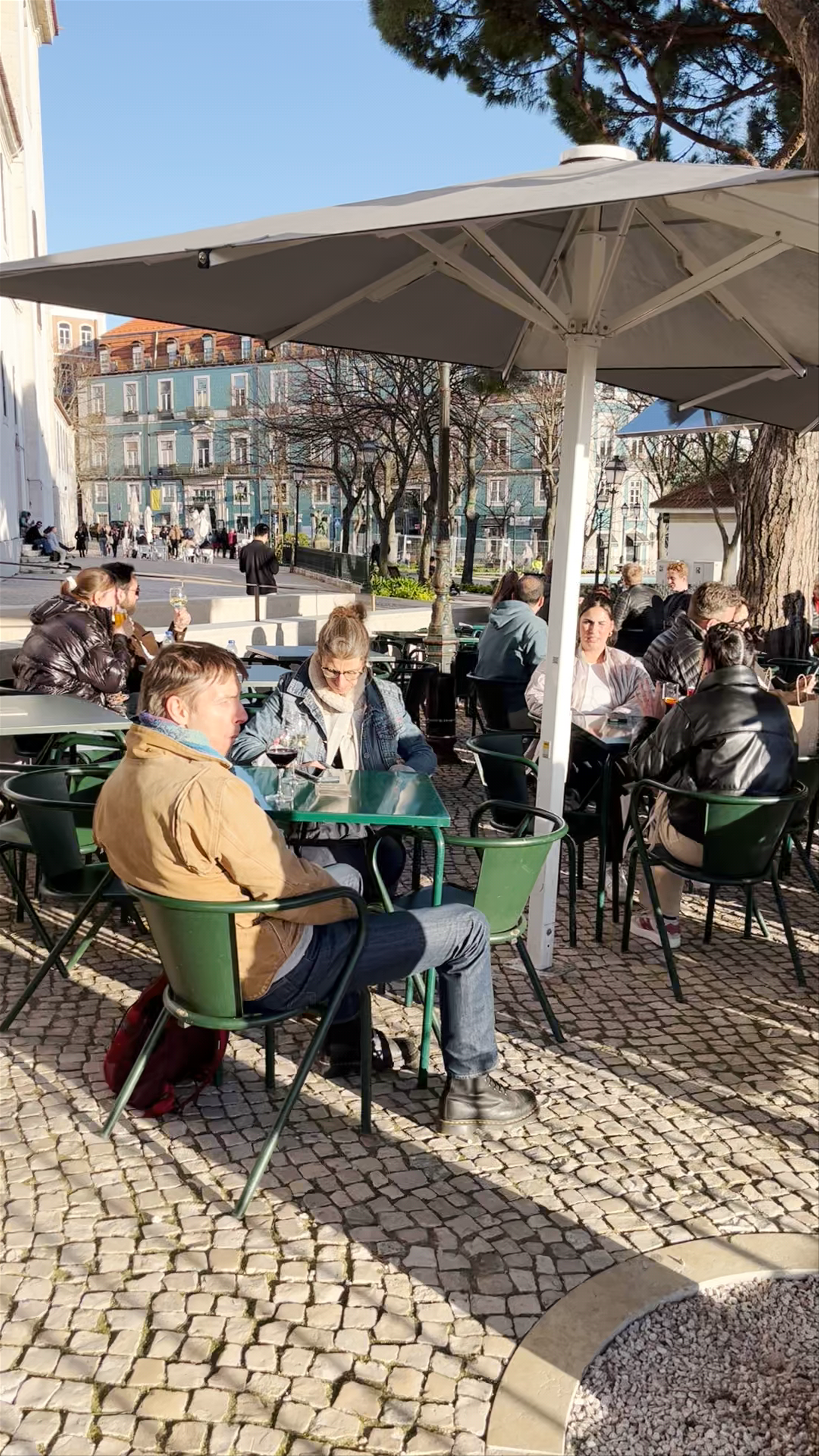 Sunlit Moments at Miradouro da Graça, Lisbon