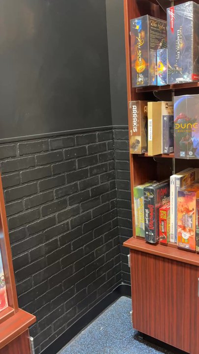 Gamers Guild AZ - A wall of different types of dungeon and dragon games from beginners to advance - Video Game Stores Near Me - Phoenix, Arizona