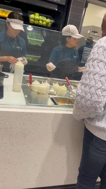 Chopt Creative Salad Co. - Rude girl putting on gloves - Salad Near Me - Atlanta, Georgia