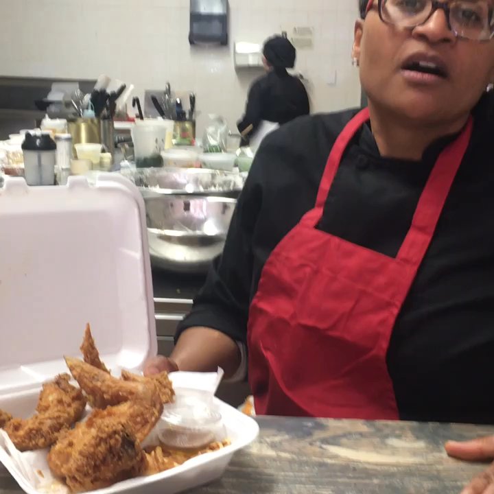 Khepera's Kitchen - Chef T showcasing one of their signature dishes, Chicken and waffles - Cooking Classes Near Me - Baltimore, Maryland