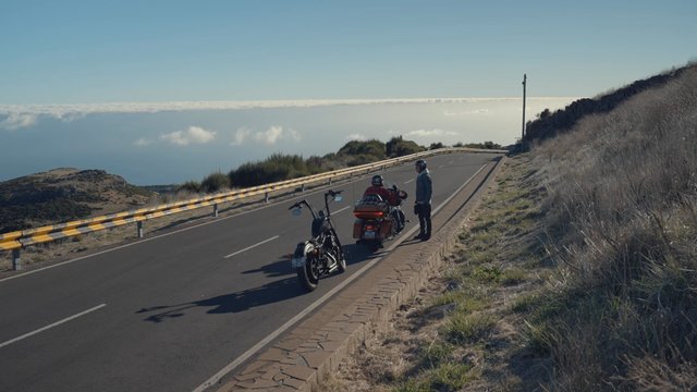 Bikers taking a break from their journey and talking to each other