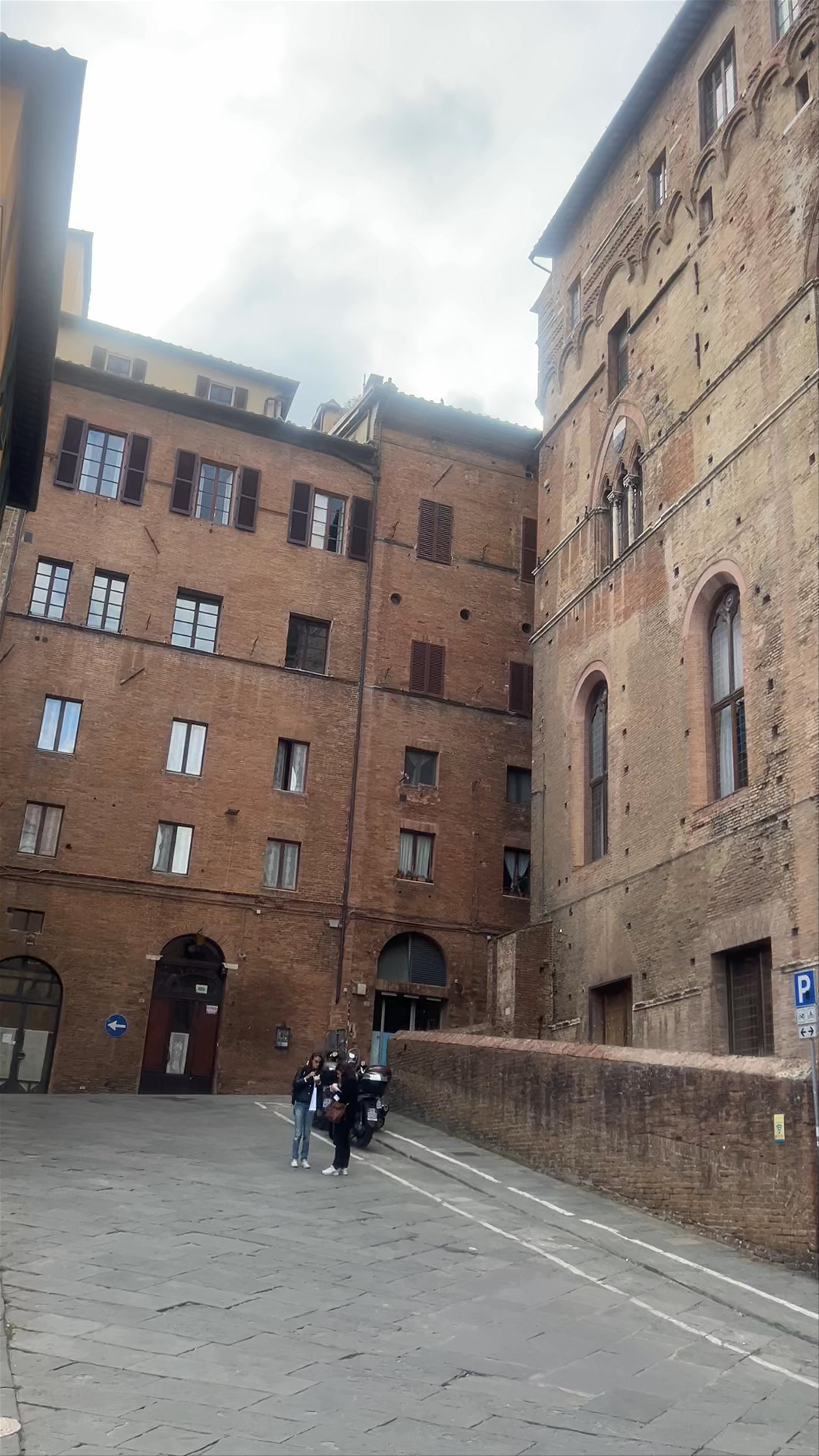 Palazzo Pubblico in Siena: Medieval Splendor Under Moody Skies