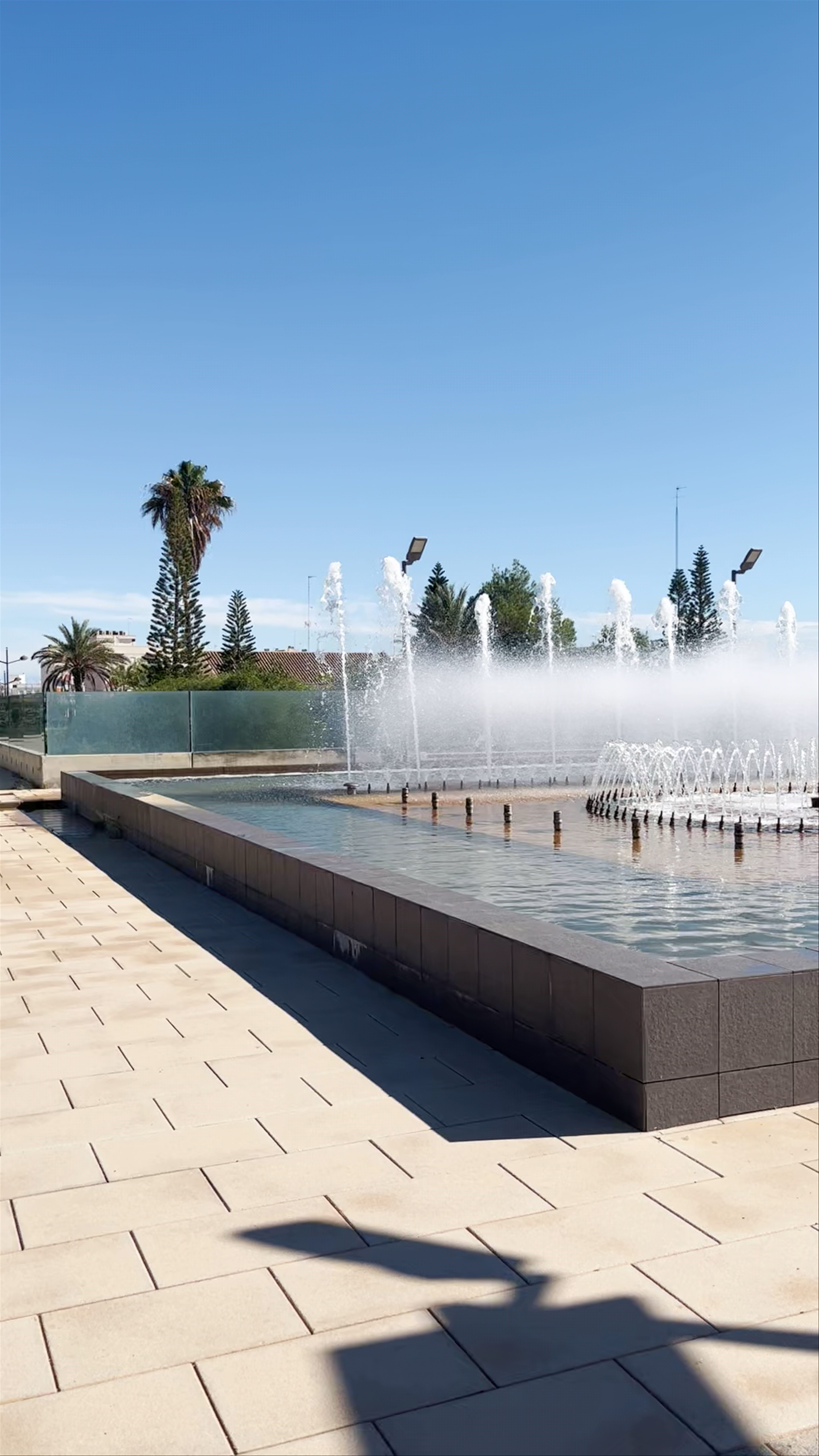 Feria Valencia: Sunlit Urban Oasis with Fountains and Palm Trees