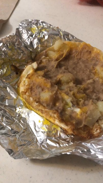 Taco Bella's - Get the Annie Taco. Comes with a over easy egg, potato, bean and cheese. - Mexican Near Me - Austin, Texas