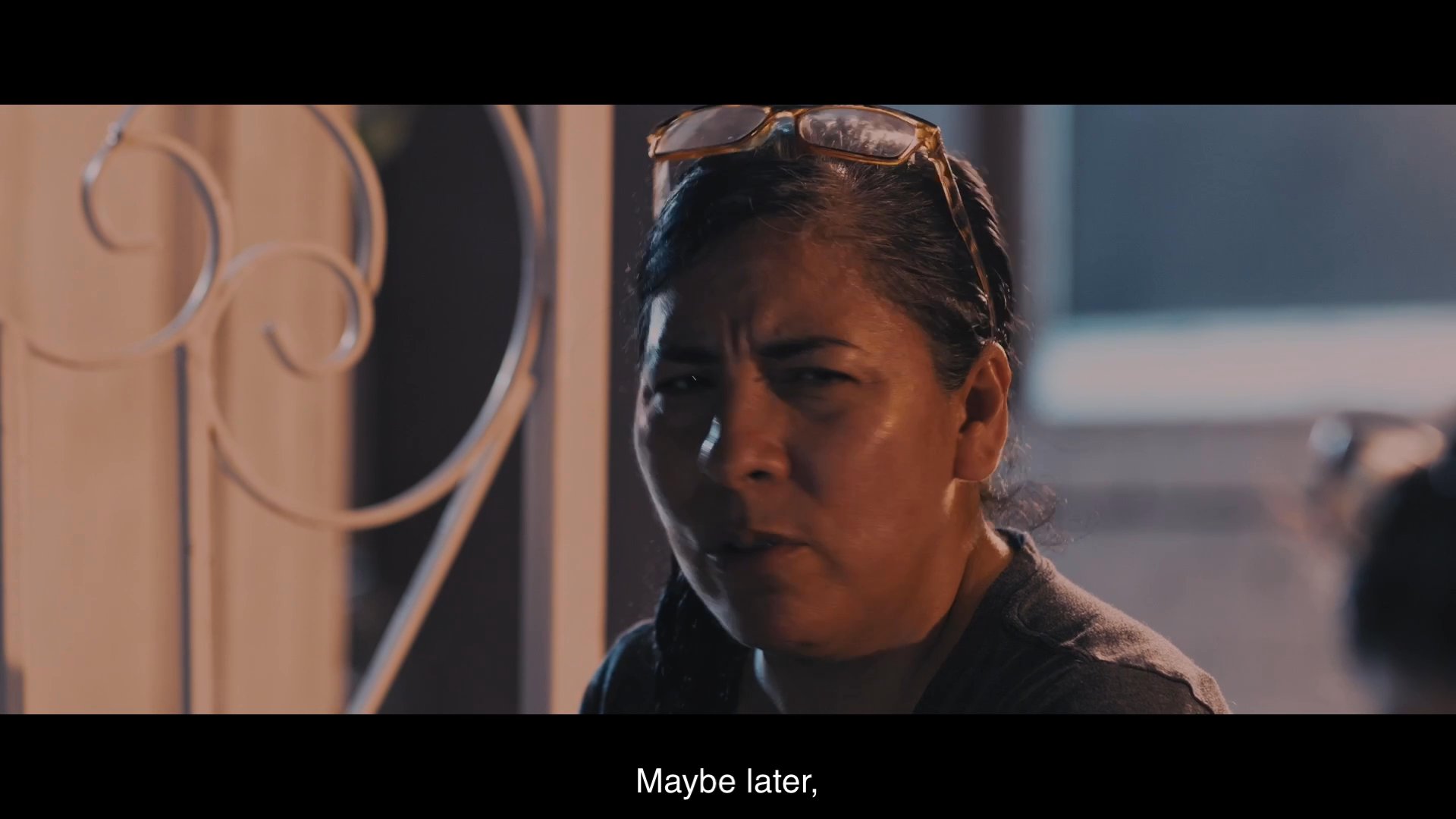 A mother and daughter engage in a poignant conversation regarding family responsibilities and caregiving. The exchange explores the emotional tension between independence and the need for support within their relationship.