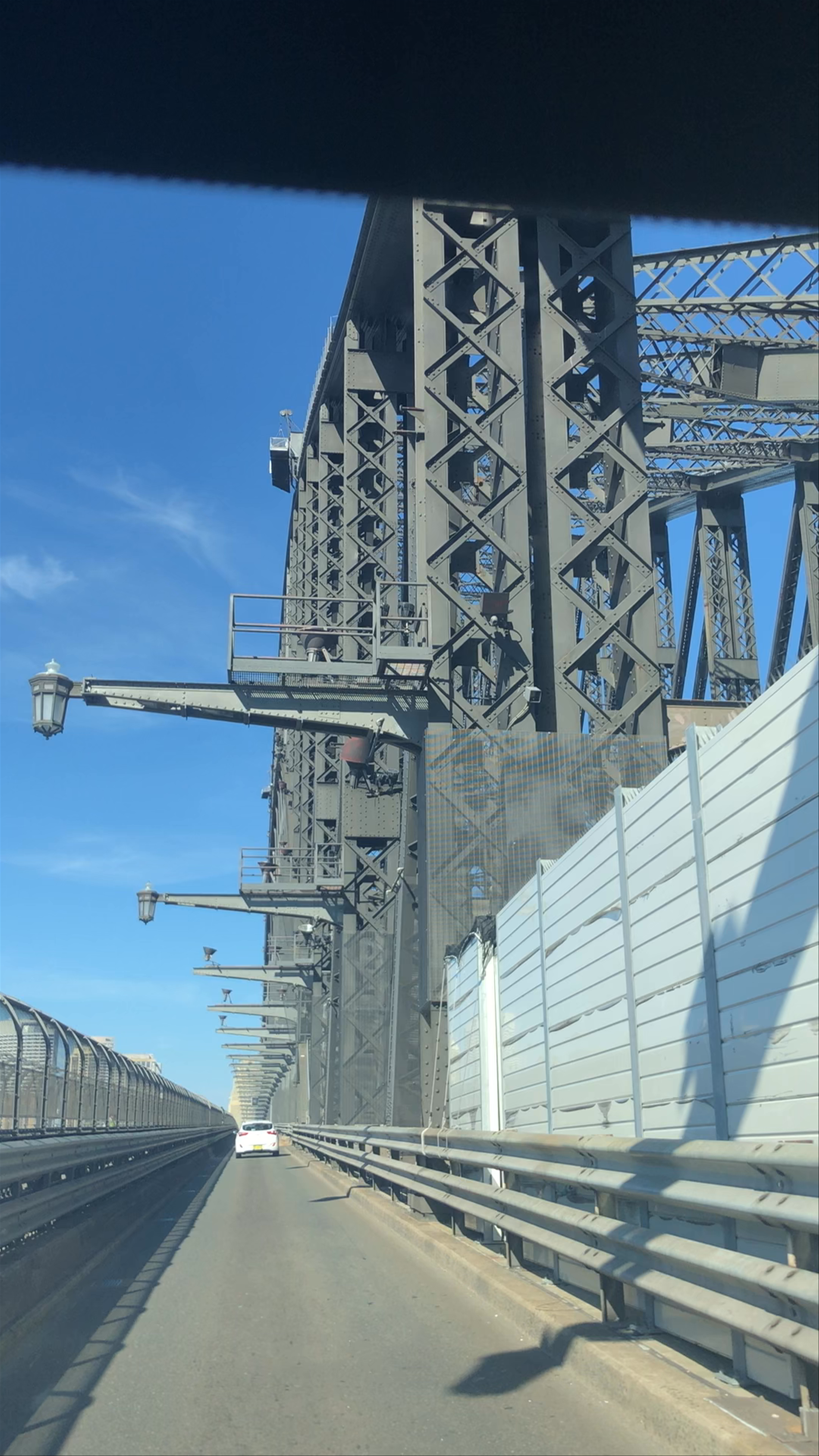 Driving Across Sydney Harbour Bridge on a Sunny Day