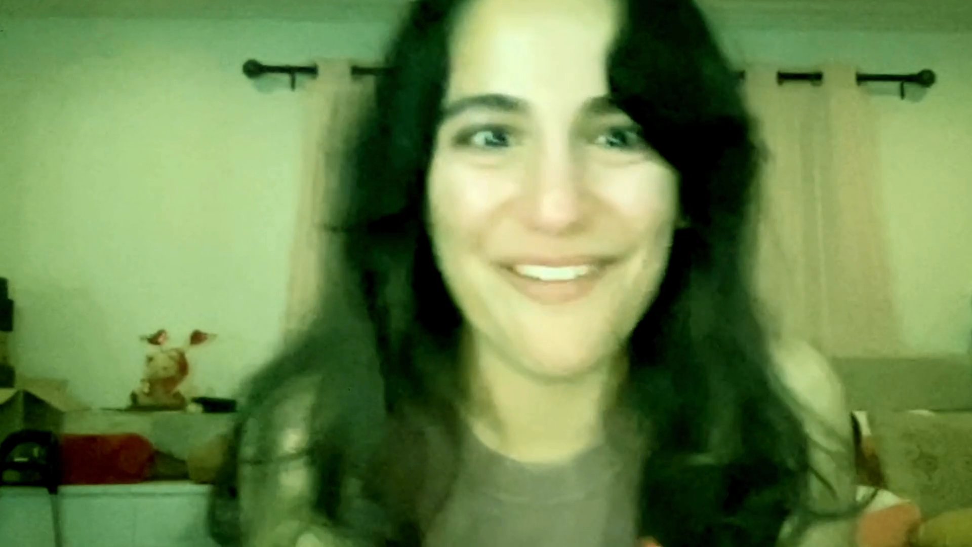A young woman undergoes a sequence of intense emotional shifts, ranging from profound sadness and crying to moments of nervous laughter and expressive speech.