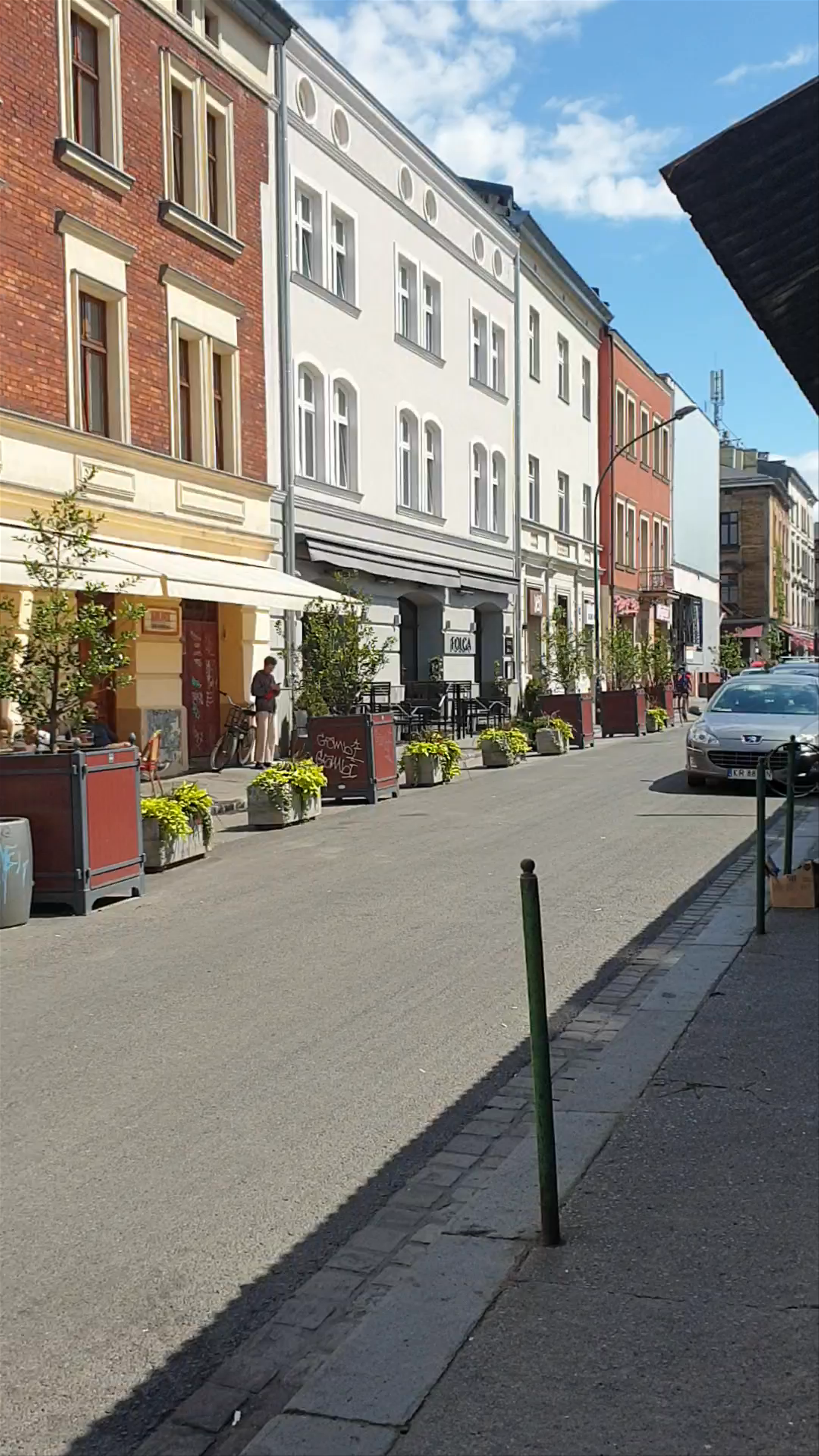 Sunny Summer Day at Plac Nowy, Kraków - Charming Urban Streetscape