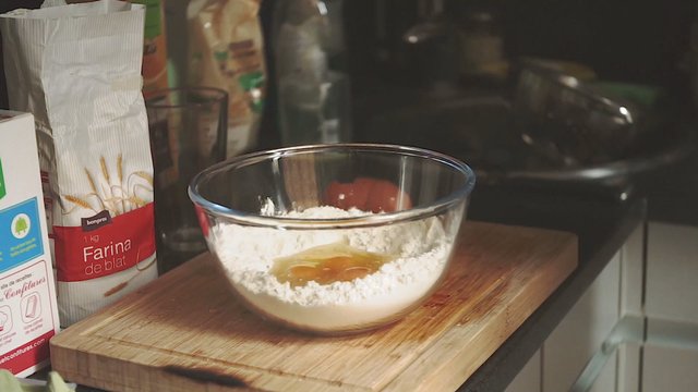 Mixing eggs and flour together