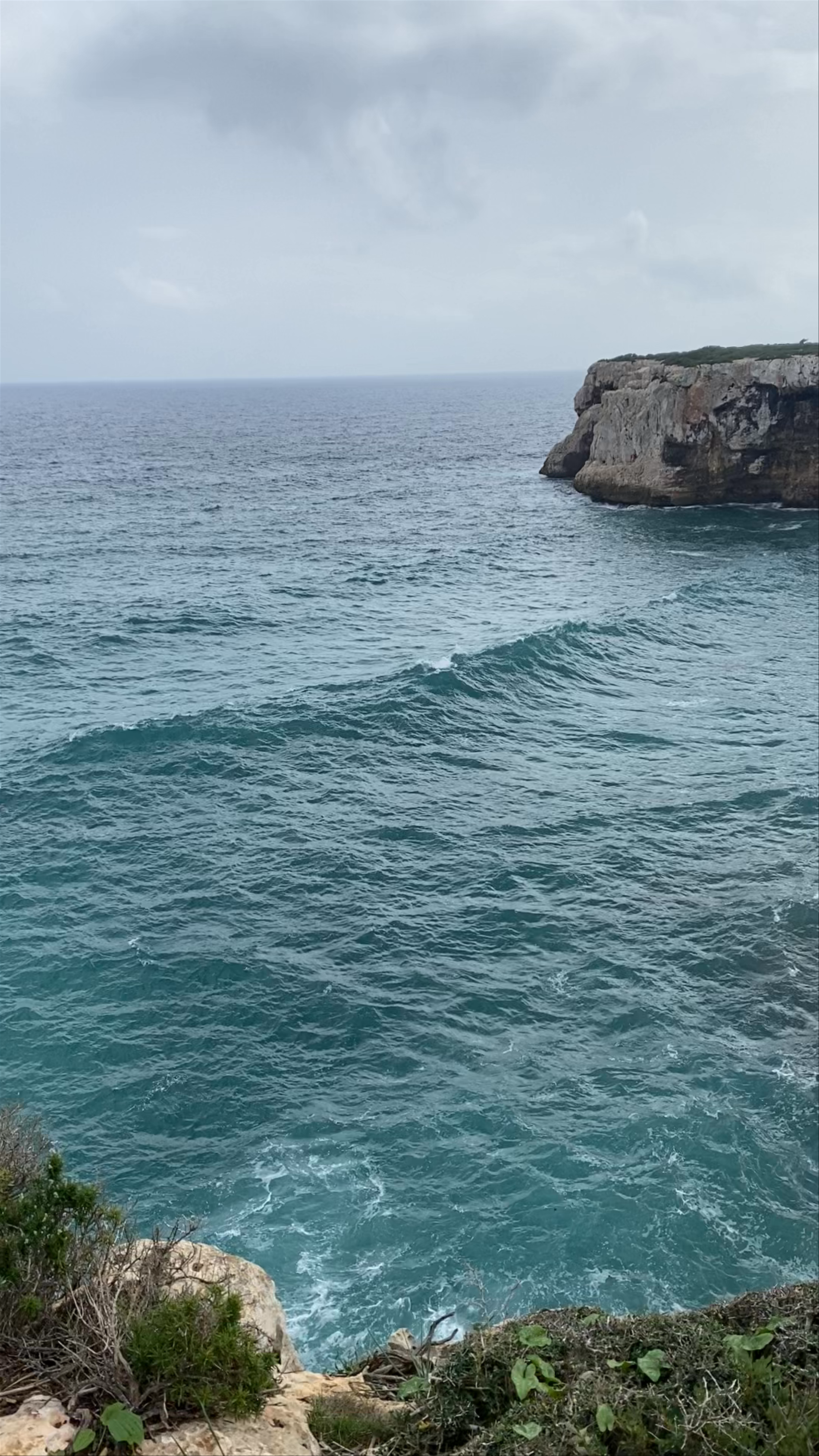 Dramatic Coastal Cliffs and Turquoise Waves at Cala Romántica, Manacor