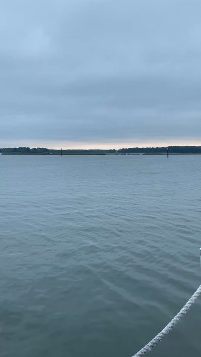 The Jetty - Sunset in the distance on a cloudy day. - Seafood Near Me - Grasonville, Maryland
