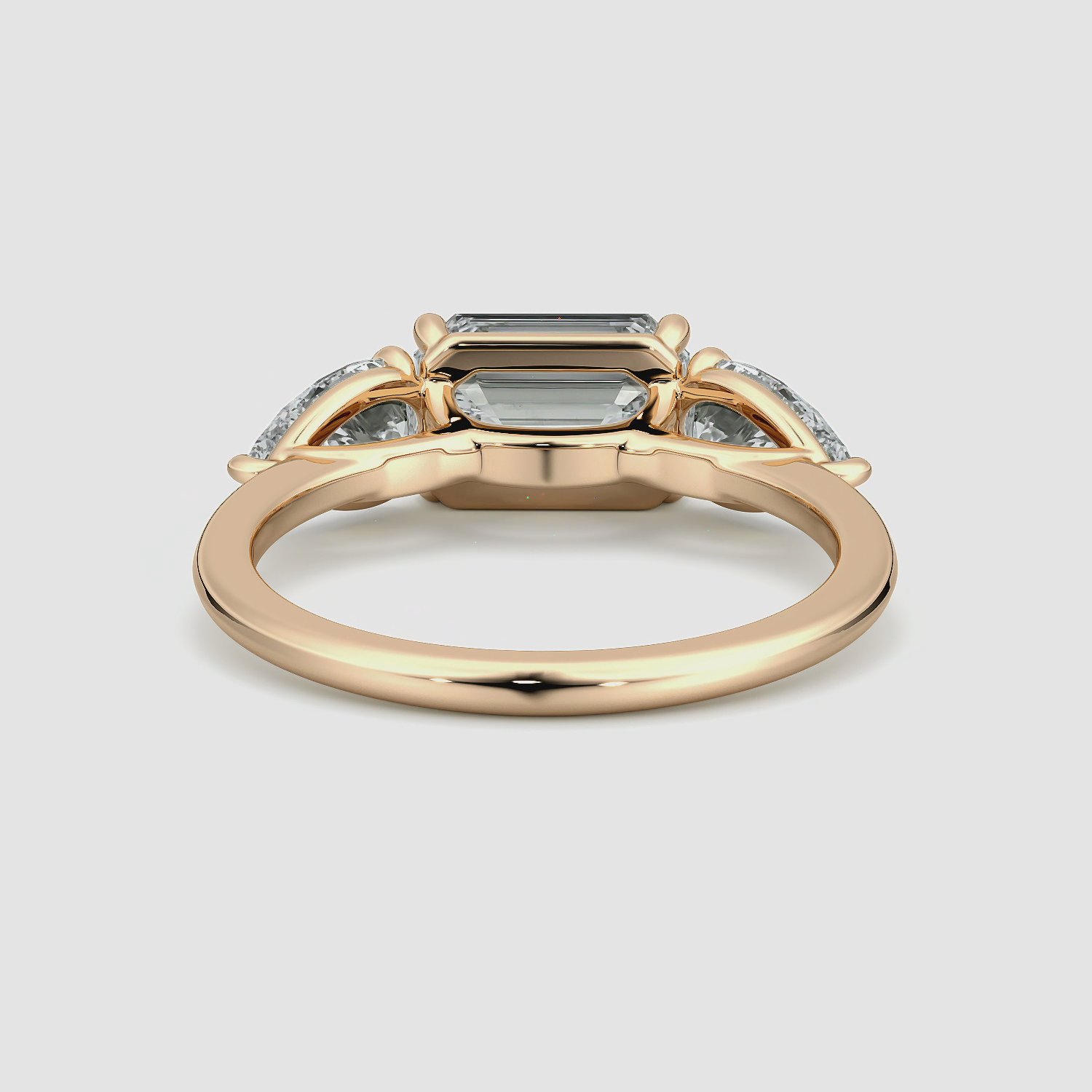 The Three Stone | Emerald | 14k | Rose Gold | bandAccent: Plain | diamondOrientation: horizontal | sideStoneCarat: 0.50ct | sideStoneShape: Pear | caratWeight: other