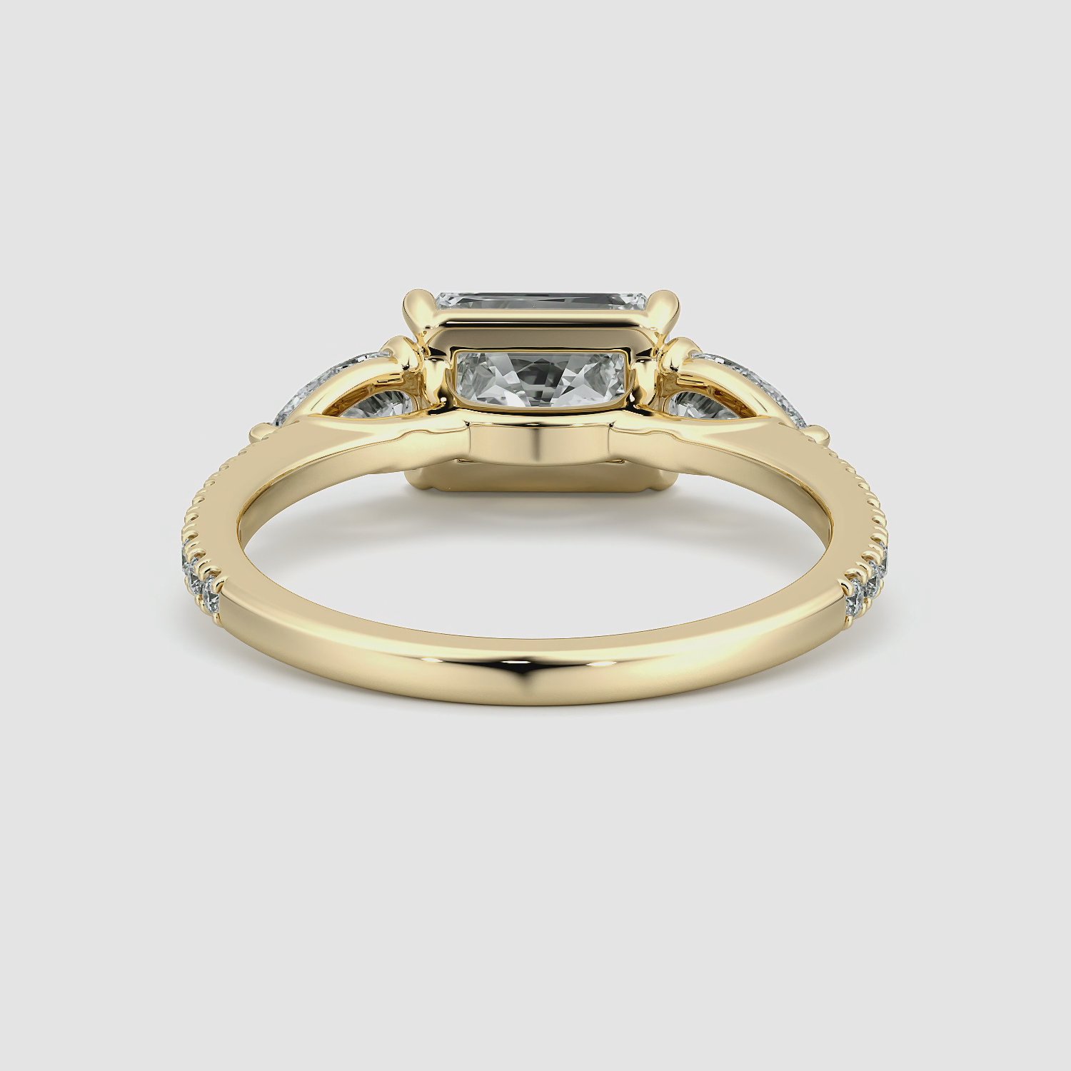 The Three Stone | Radiant | 18k | Yellow Gold | bandAccent: Pavé | diamondOrientation: horizontal | sideStoneCarat: 0.25ct | sideStoneShape: Pear | caratWeight: other