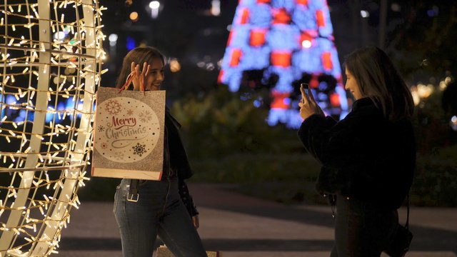 Taking photos with Christmas gift bags